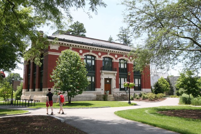 Red and white building surrounded by trees