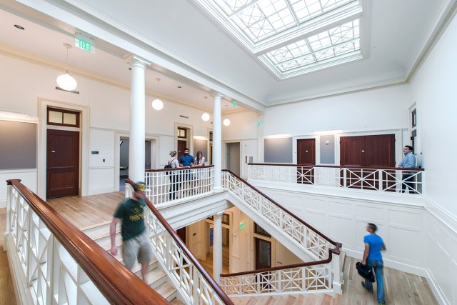 Hallways and stairs in a building with white walls