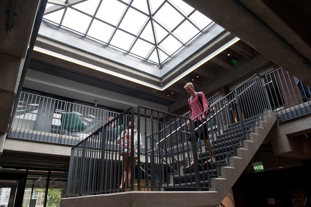 An open stairway with a skylight on the ceiling