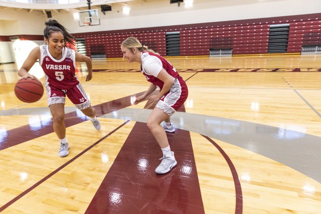 Women playing basketball