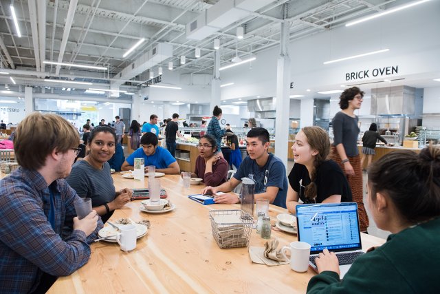 Students eating together in Gordon Commons