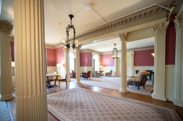 A historic room decorated in burgundy