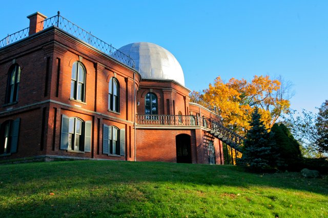An orange building with a large, white dome on top