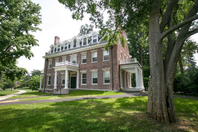 A tan building with white trim
