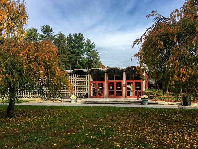 A small building with a wavy roof