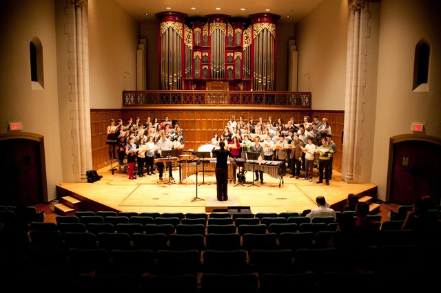 Choir rehearsing in a concert hall
