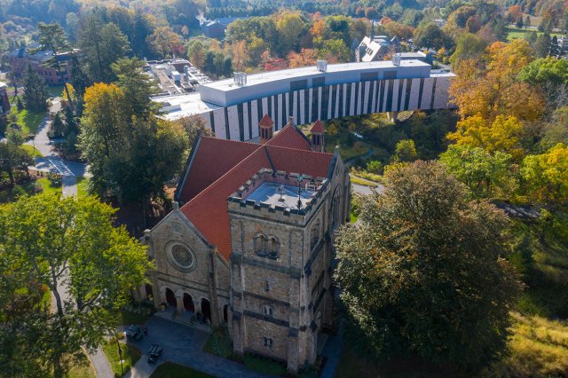 A campus scene including a large chapel and modern building 