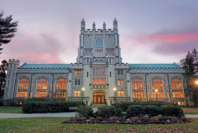 A large Gothic building at dusk