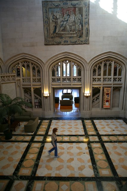 A person walking through an interior open space, viewed from above