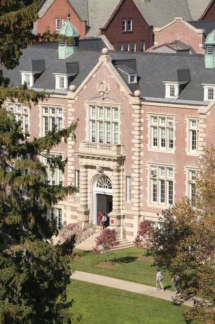 A large, tan building seen from afar
